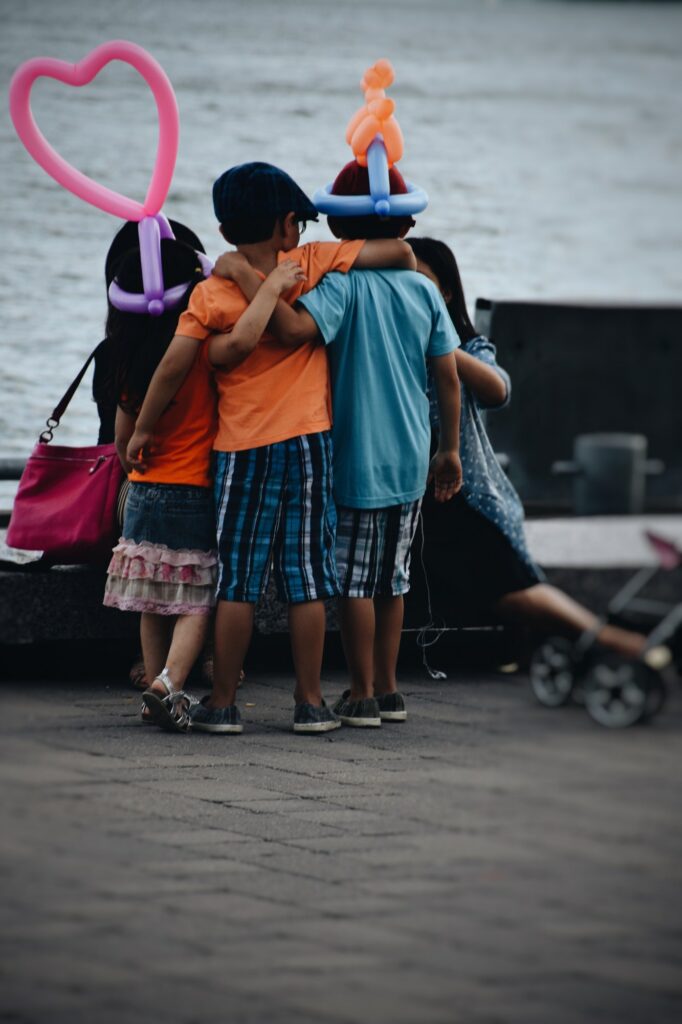 Children with balloons posing for a picture